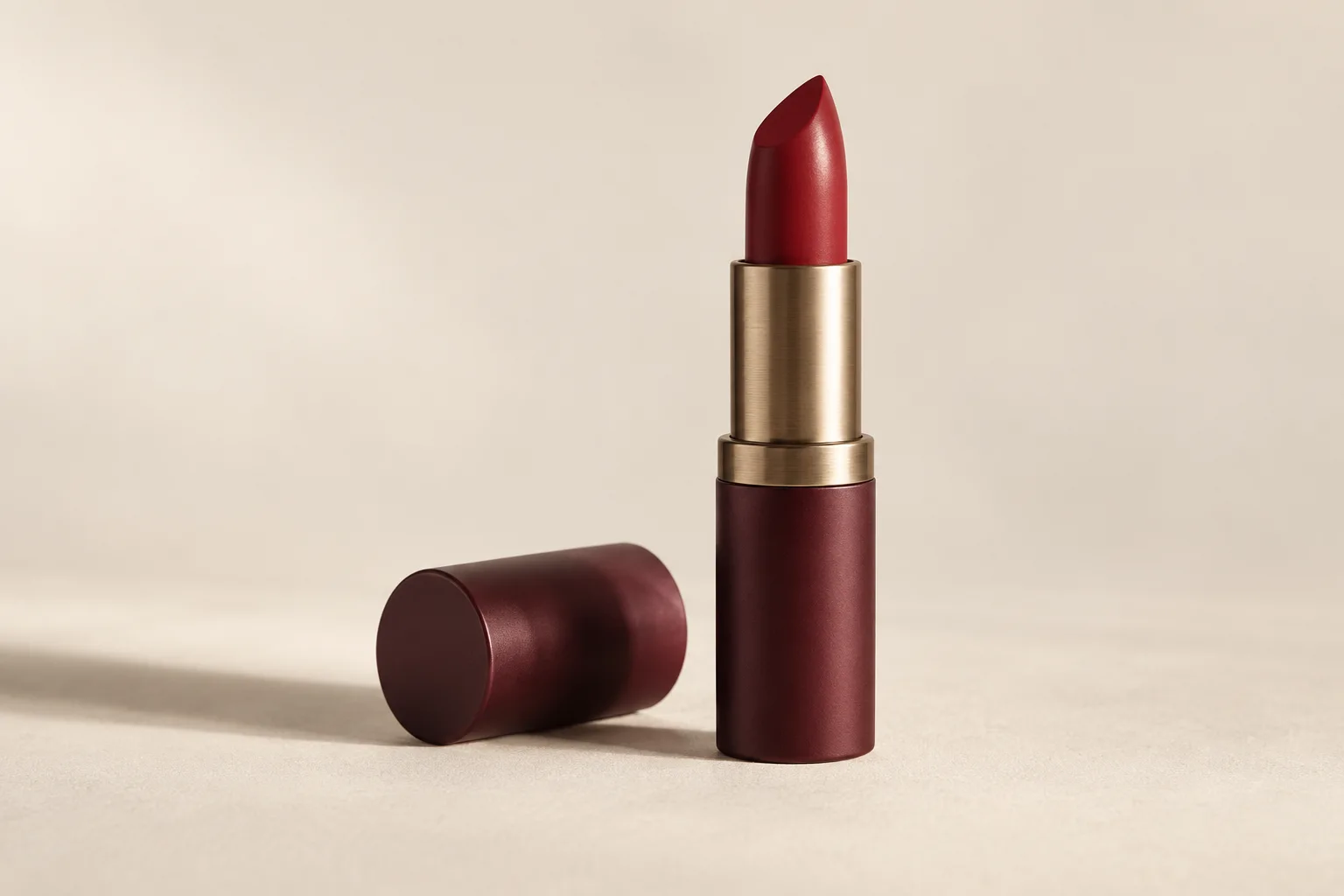 Open red lipstick without a brand, in a burgundy package